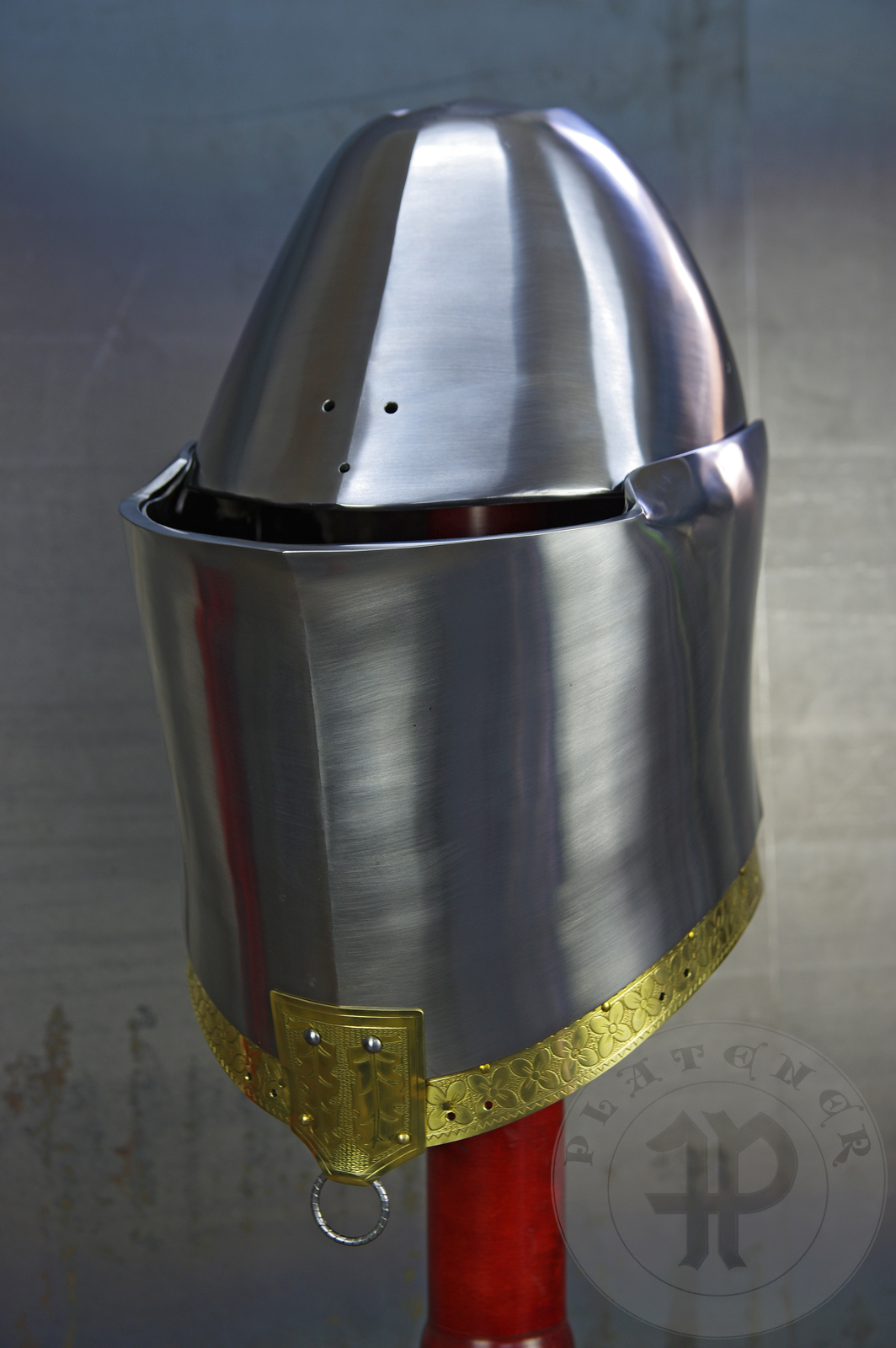 My interpretation of a tournament helm based on the Henry V helm - part of his funeral achievement from Westminster Abbey. It represents an early style of jousting helm dated for 1380-1420. It is composed of five primary plates: rear plate, brown plate, crown plate, face plate and monstrous thick reinforcing plate in front.