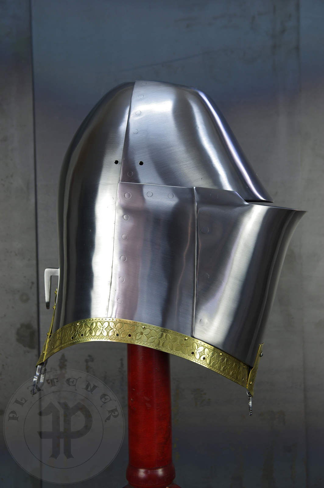 My interpretation of a tournament helm based on the Henry V helm - part of his funeral achievement from Westminster Abbey. It represents an early style of jousting helm dated for 1380-1420. It is composed of five primary plates: rear plate, brown plate, crown plate, face plate and monstrous thick reinforcing plate in front.