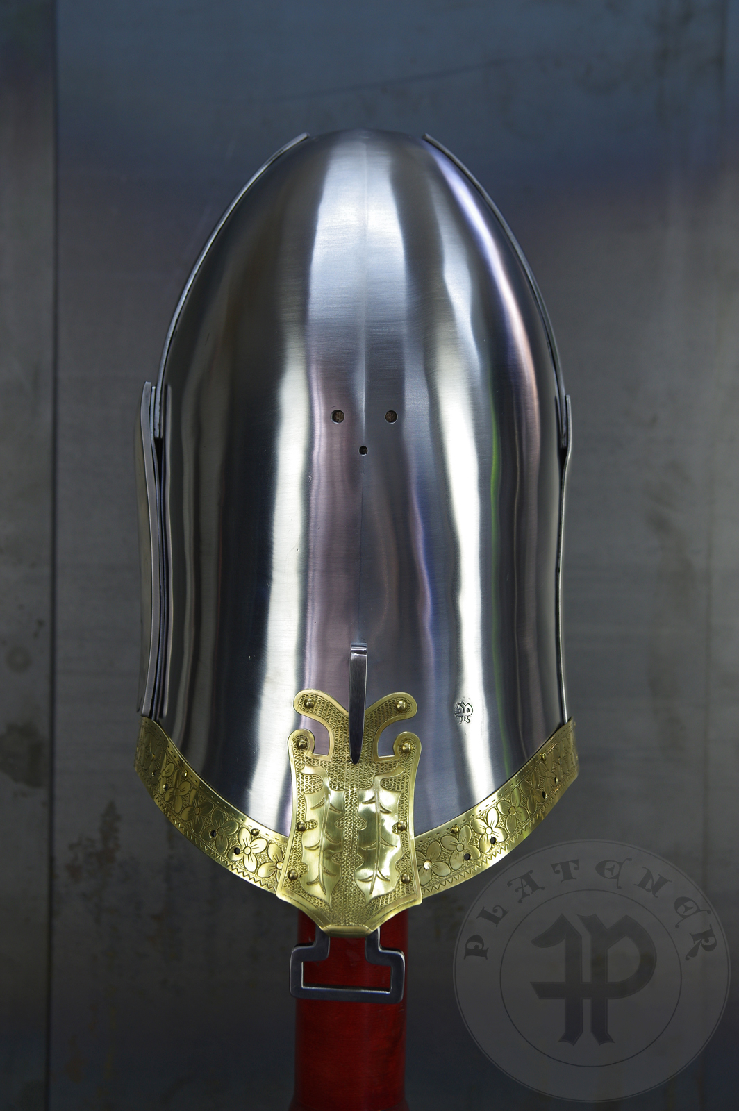 My interpretation of a tournament helm based on the Henry V helm - part of his funeral achievement from Westminster Abbey. It represents an early style of jousting helm dated for 1380-1420. It is composed of five primary plates: rear plate, brown plate, crown plate, face plate and monstrous thick reinforcing plate in front.