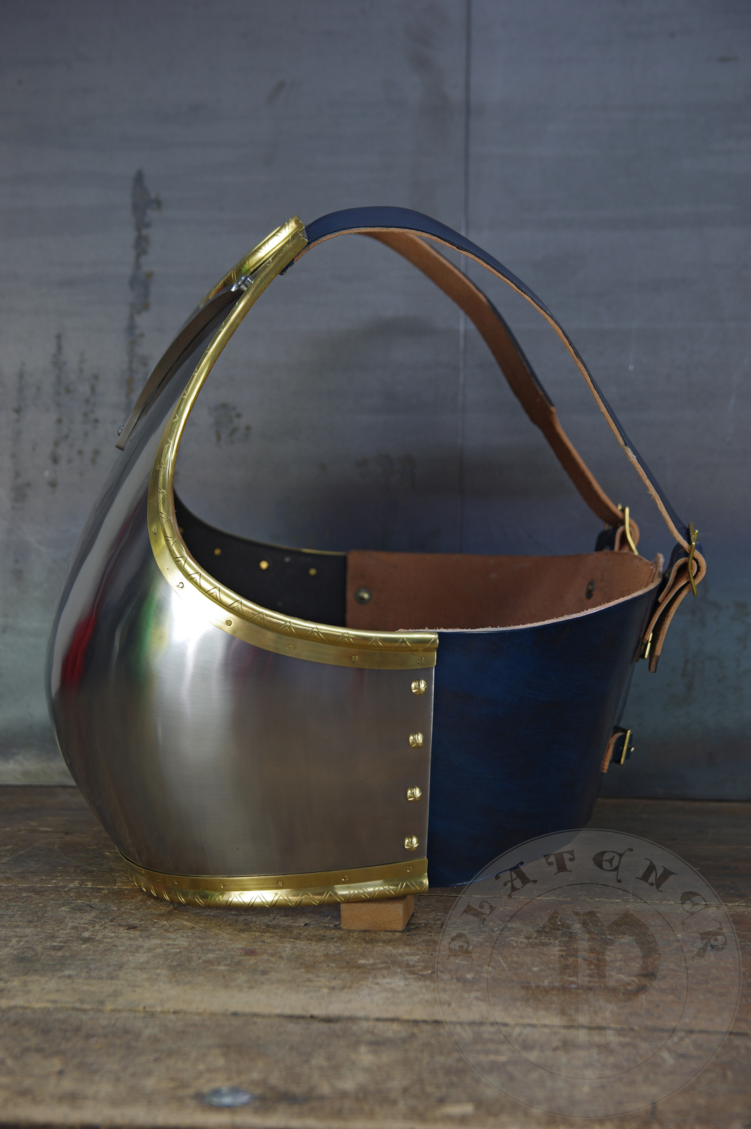 Here is a classic breastplate with V-neck stop rib (to deflect thrusts away from the neck) based on Churburg CH14. I enhanced its simple aesthetic by adding brass decorations around the edges with a geometrical, hand filed pattern. They were inspired by decorations from Churburg CH13 segmented breastplate and depictions in art from this period