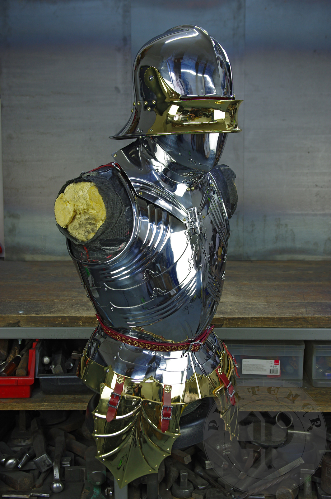 The high gothic set circa 1480-1485 in Helmschmied style consists of sallet, bevor and cuirass. They are made of steel in various thickness: 2 mm; 1,5 mm and 1,2 mm and heat hardened and tempered up to 42 HRC for cuirass with bevor and 38 HRC for sallet. The visor, lower lames and tassets are brass gilded. I also crafted handmade steel buckles for this set. Overall it involved around 850 of work hours to make it.
